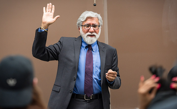 Photo of 蜜穴视频 Professor Raising Hand in Front of Class