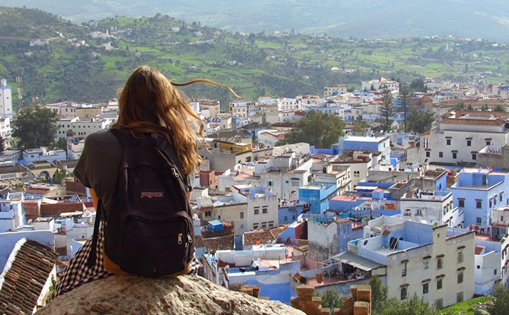 A study abroad student in Morocco, overlooking a town.