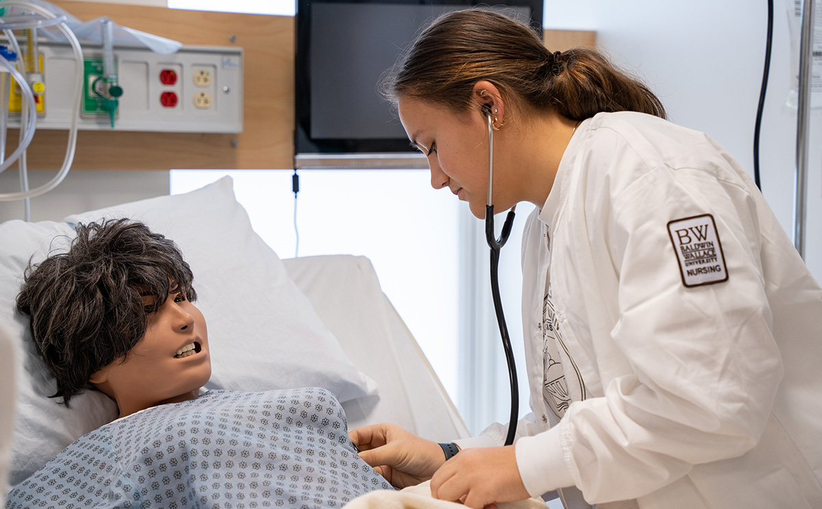Nursing student with patient simulator